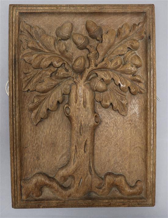 An early 18th century oak panel, carved with an oak tree and acorns 33 x 24cm